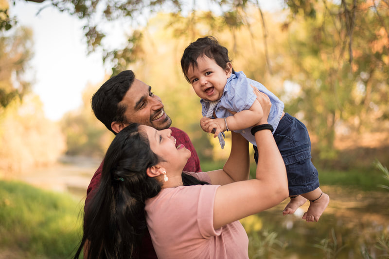 outdoor family portrait photo with infant at Putah Creek